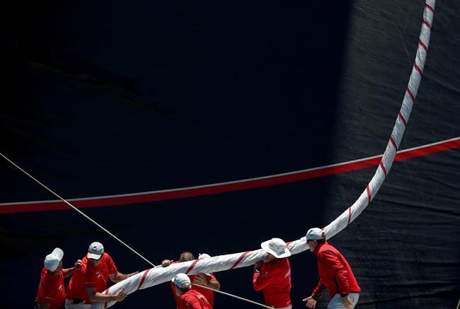 Image of Asia: Preparing a sail for yacht race | iNFOnews.ca