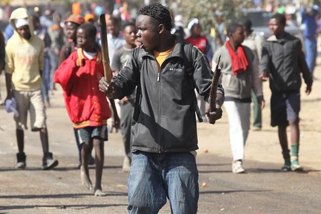 Police battle rioters in Zimbabwe's capital | iNFOnews.ca