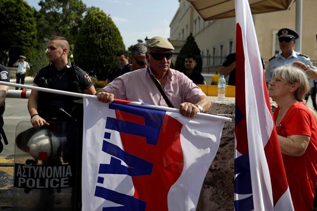 Greek anti-austerity protesters pelt police with fish | iNFOnews.ca
