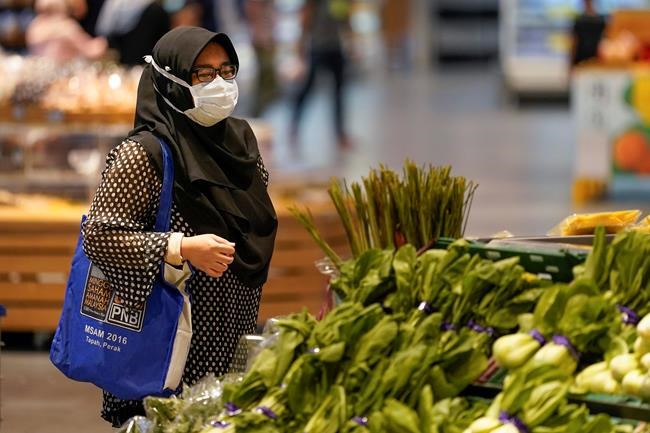 Malaysia PM quarantines as minister tests positive for virus | iNFOnews.ca