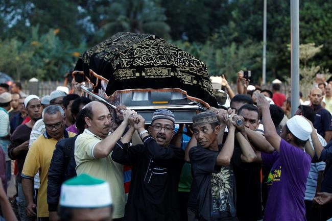 21 boys who died in school fire buried in Malaysia | iNFOnews.ca