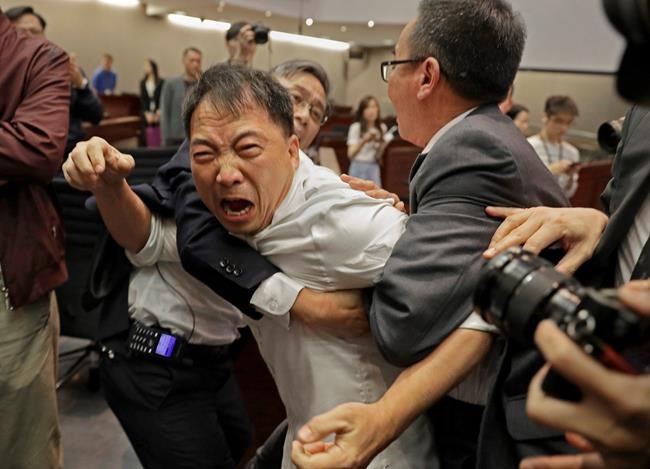 Chaotic scenes at Hong Kong legislature over extradition law | iNFOnews.ca