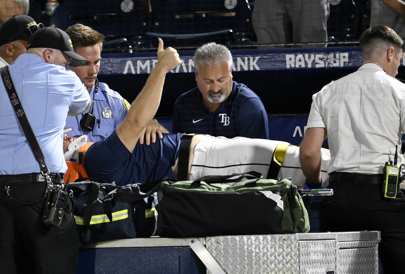 Rays pitcher carted off field and taken to hospital after foul ball into dugout hits him in face | iNFOnews.ca
