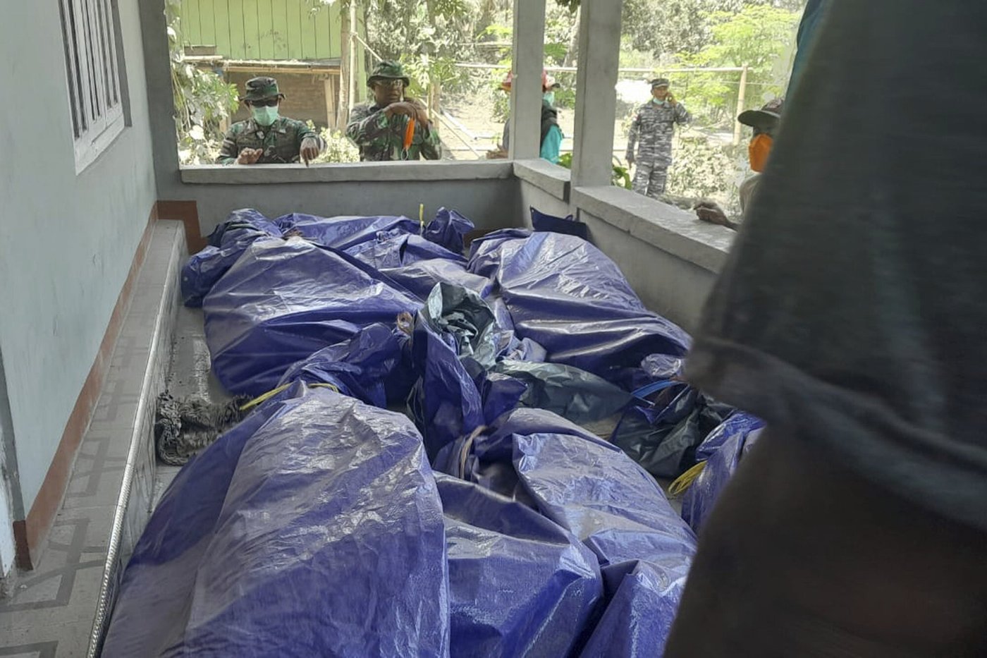 Indonesian rescuers dig through volcanic ash after eruption kills 9 and destroys buildings | iNFOnews.ca