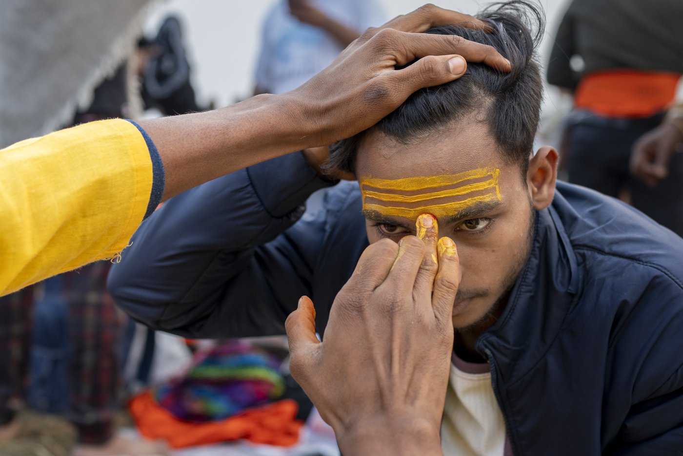 Sacred strokes of color on foreheads are a major display of Hinduism at India’s Maha Kumbh festival | iNFOnews.ca