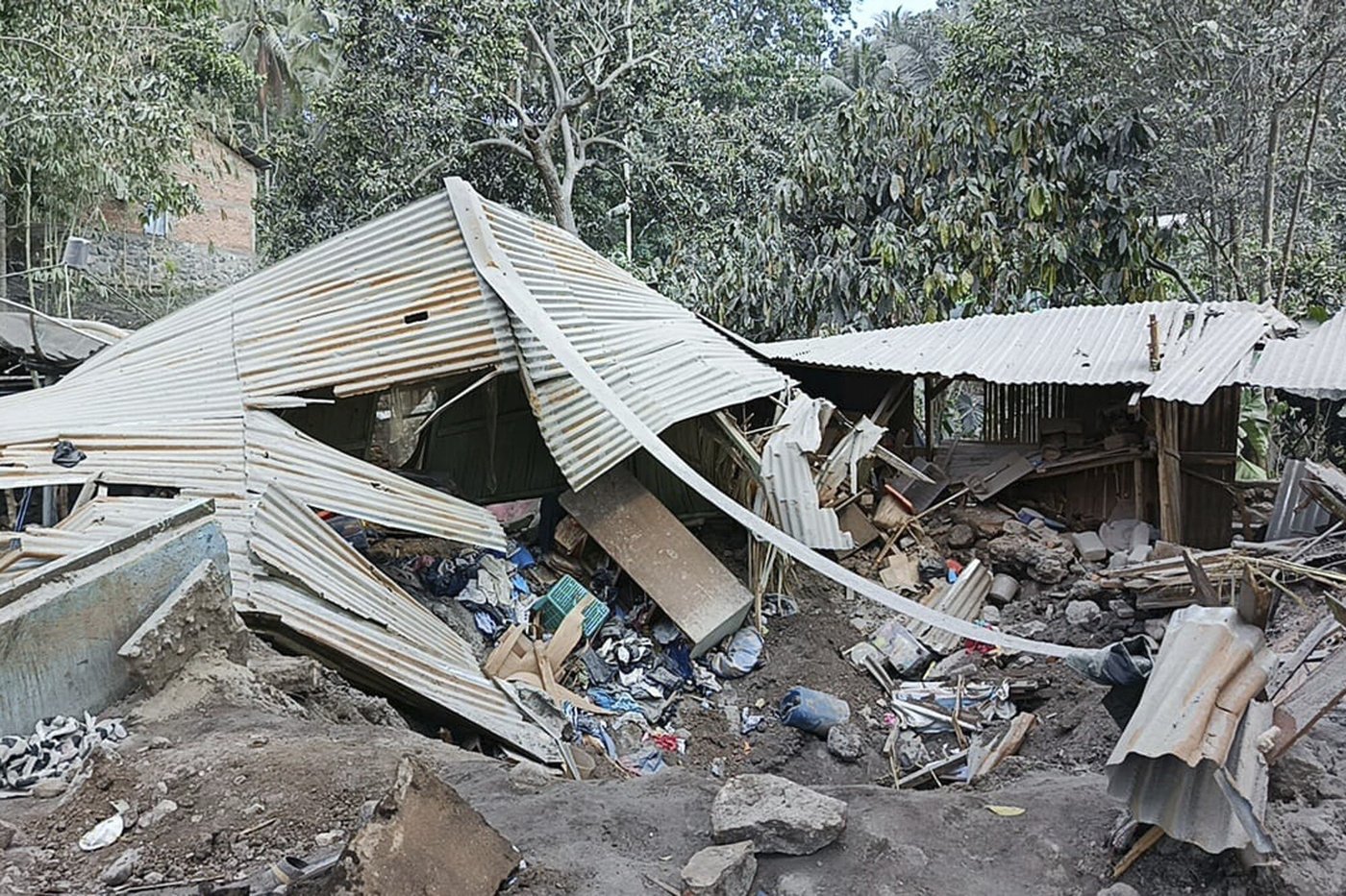 Indonesian rescuers dig through volcanic ash after eruption kills 9 and destroys buildings | iNFOnews.ca