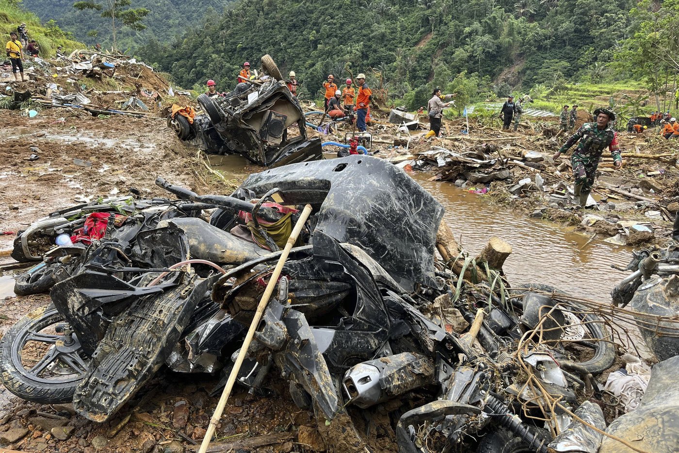 Death toll in deadly flooding and landslides in Indonesia rises to 21 | iNFOnews.ca