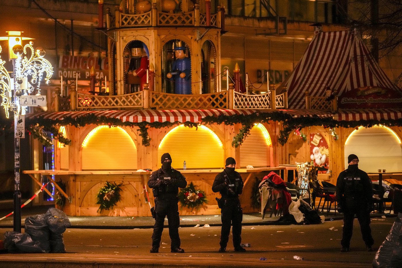 Germans mourn attack on Christmas market with no answers about why | iNFOnews.ca