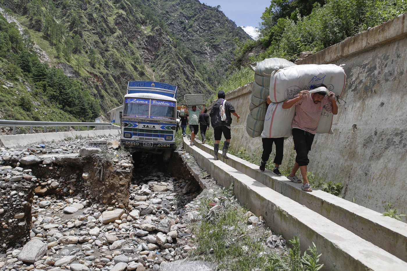 Rescuers search for 19 missing and recover 9 bodies after flooding in Nepal | iNFOnews.ca