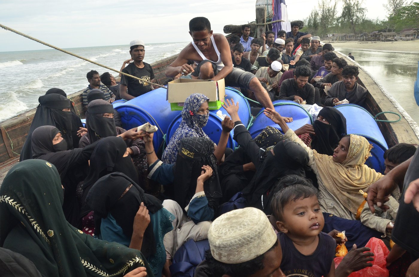 Over 100 Rohingya refugees fleeing persecution in Myanmar arrive in Indonesia's Aceh | iNFOnews.ca Over 100 Rohingya refugees fleeing persecution in Myanmar arrive in Indonesia's Aceh | iNFOnews.ca