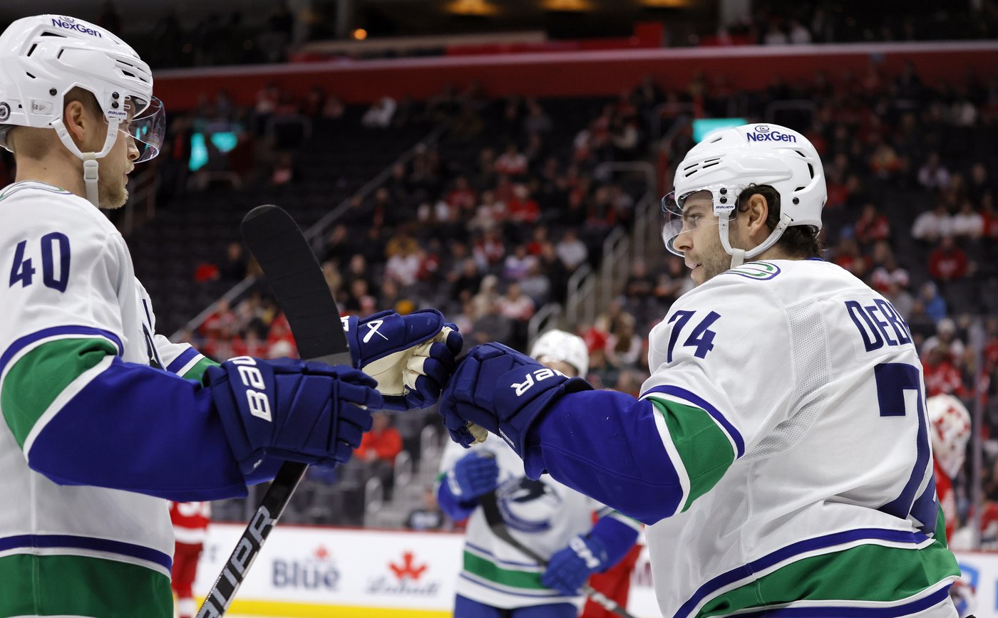 Jake DeBrusk scores hat trick, including OT game-winner, as Canucks top Red Wings 5-4 | iNFOnews.ca