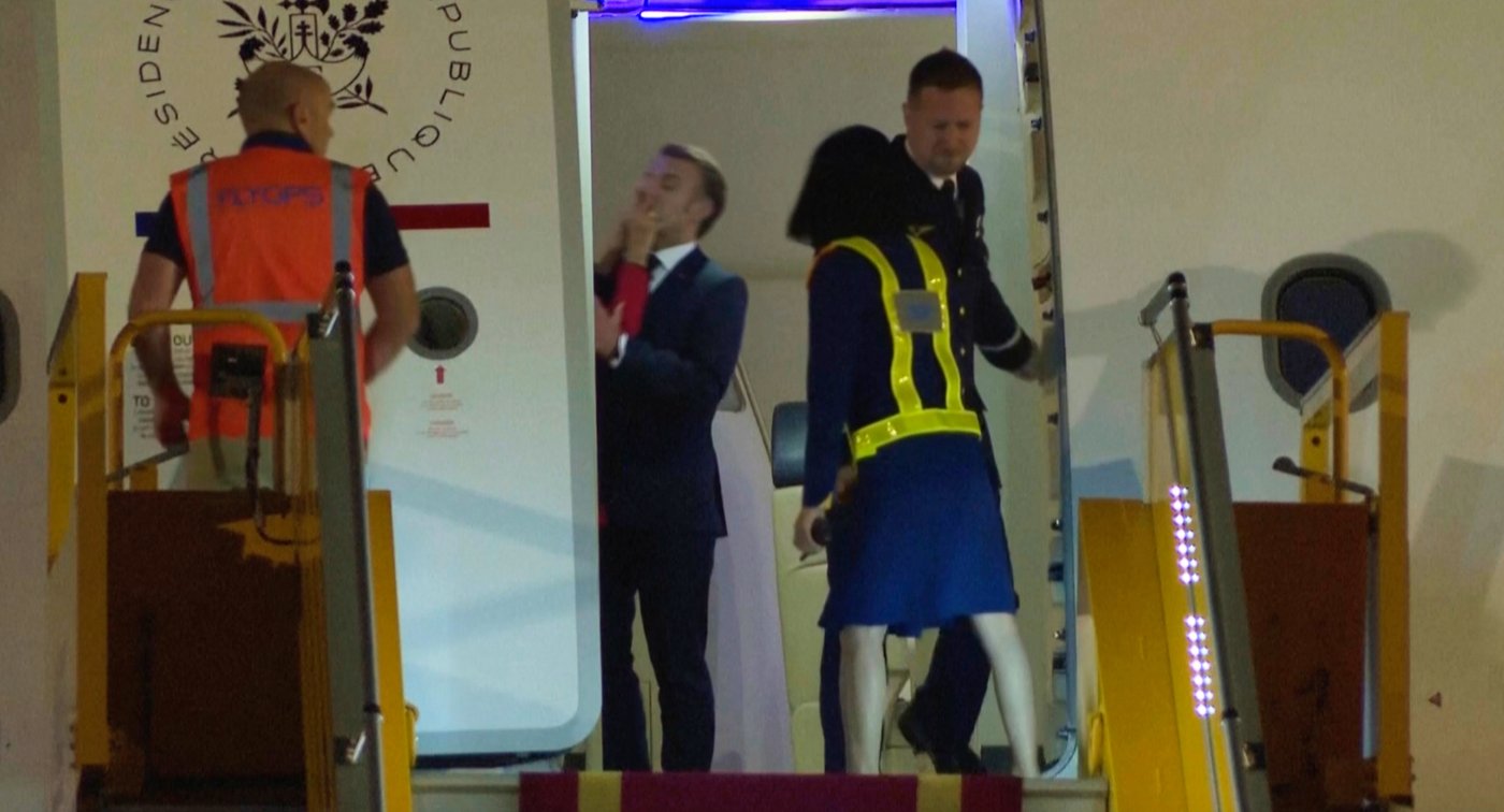 France's first lady seems to push her husband as they land in Vietnam. He says they were joking | iNFOnews.ca
