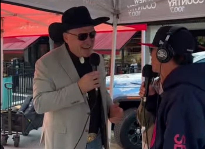 Tom Dyas with a cowboy hat on.