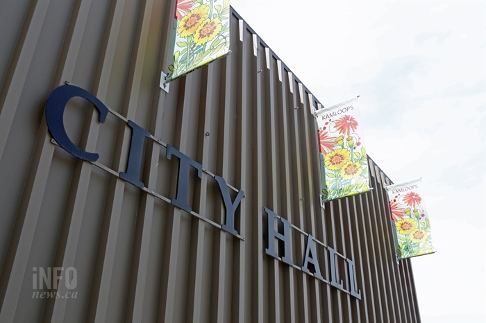 An exterior wall with signage reading, "City Hall."