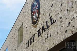 The front of Kamloops city hall features the city coat of arms.