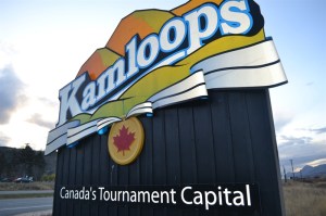 A roadside entrance sign depicts the City of Kamloops logo