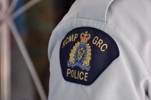 A close up of the RCMP logo on an officer's shoulder.