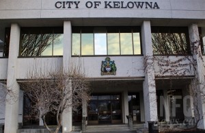 A photo of the front of Kelowna City Hall with the sign visible.