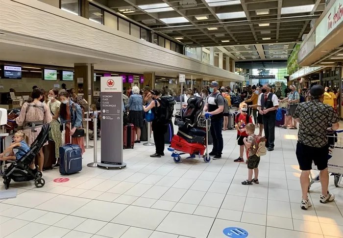 People in line at Kelowna International Airport.