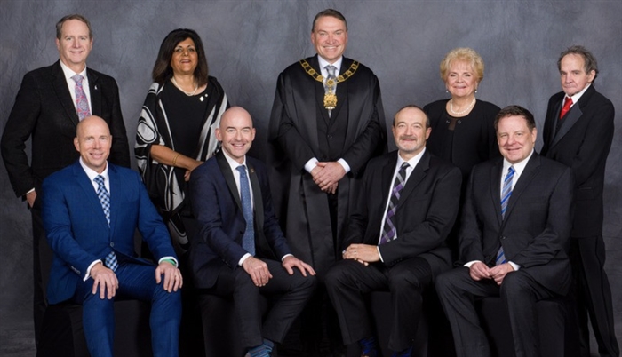 Kelowna city council poses for a group portrait.