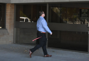 Joel Eric Carlson walking into a courthouse.