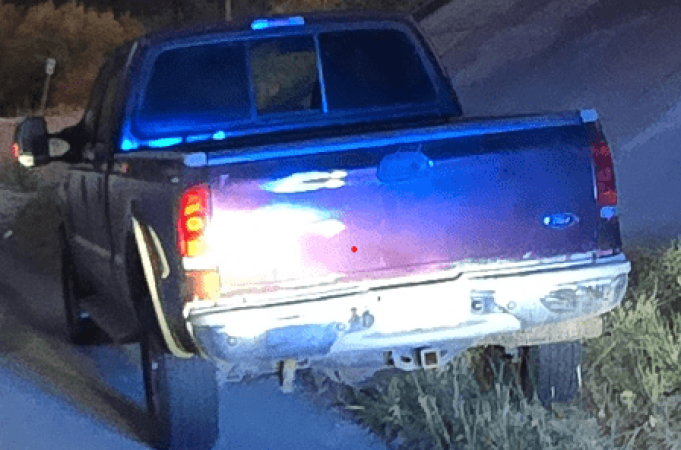 Thieves tear ATM from Peachland bank | iNFOnews.ca Rear of a blue pickup truck parked on the side of a street at night.