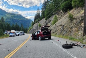 A damaged SUV on a mountain highway.