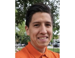 Vincent Florence, wearing an orange shirt, is pictured in a recent photo.